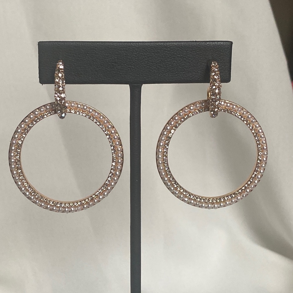 Gold tone earrings with clear stones and faux pearls